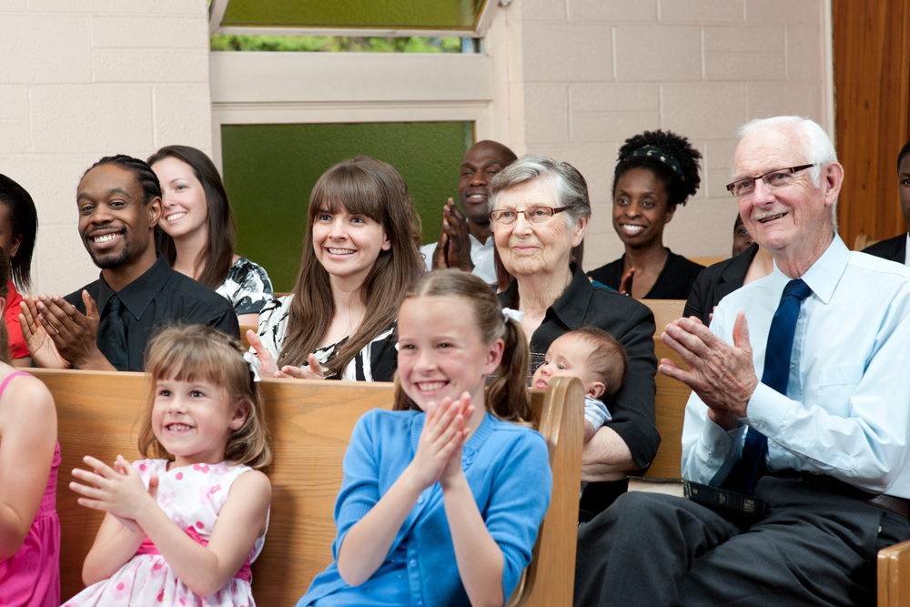 Audience applauding in a church